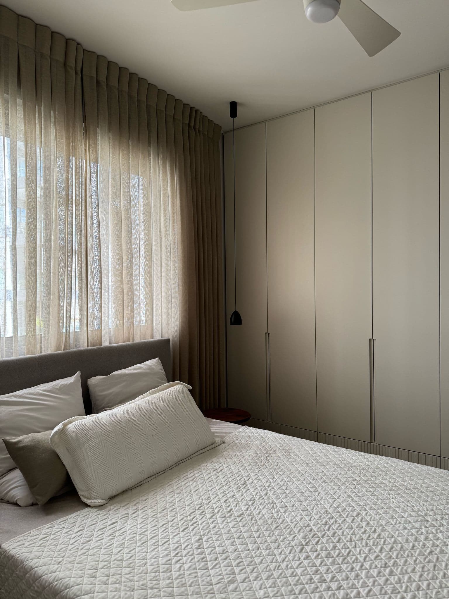 master bedroom beige curtains built in wardrobes