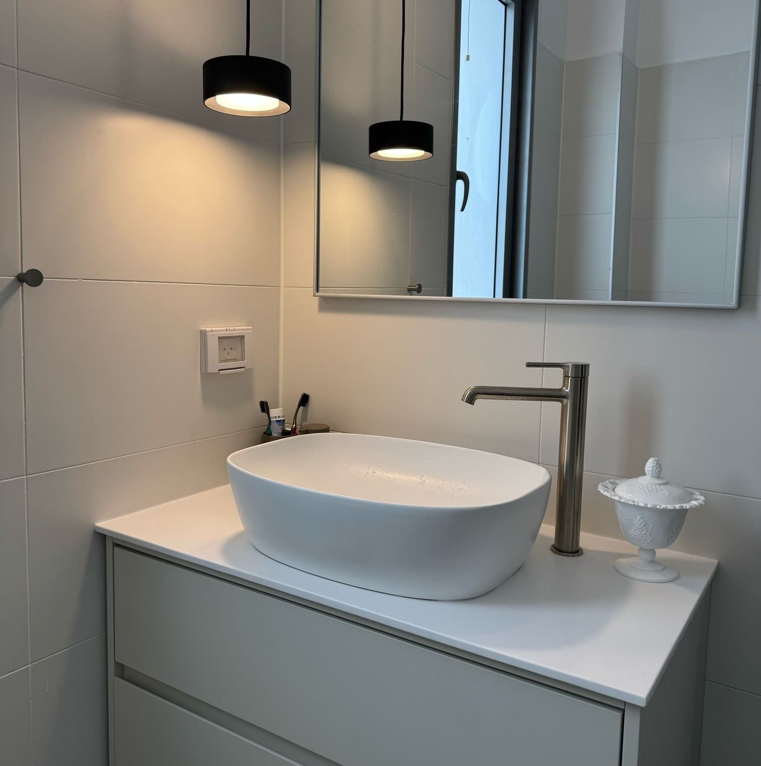 modern bathroom floating vanity black pendants