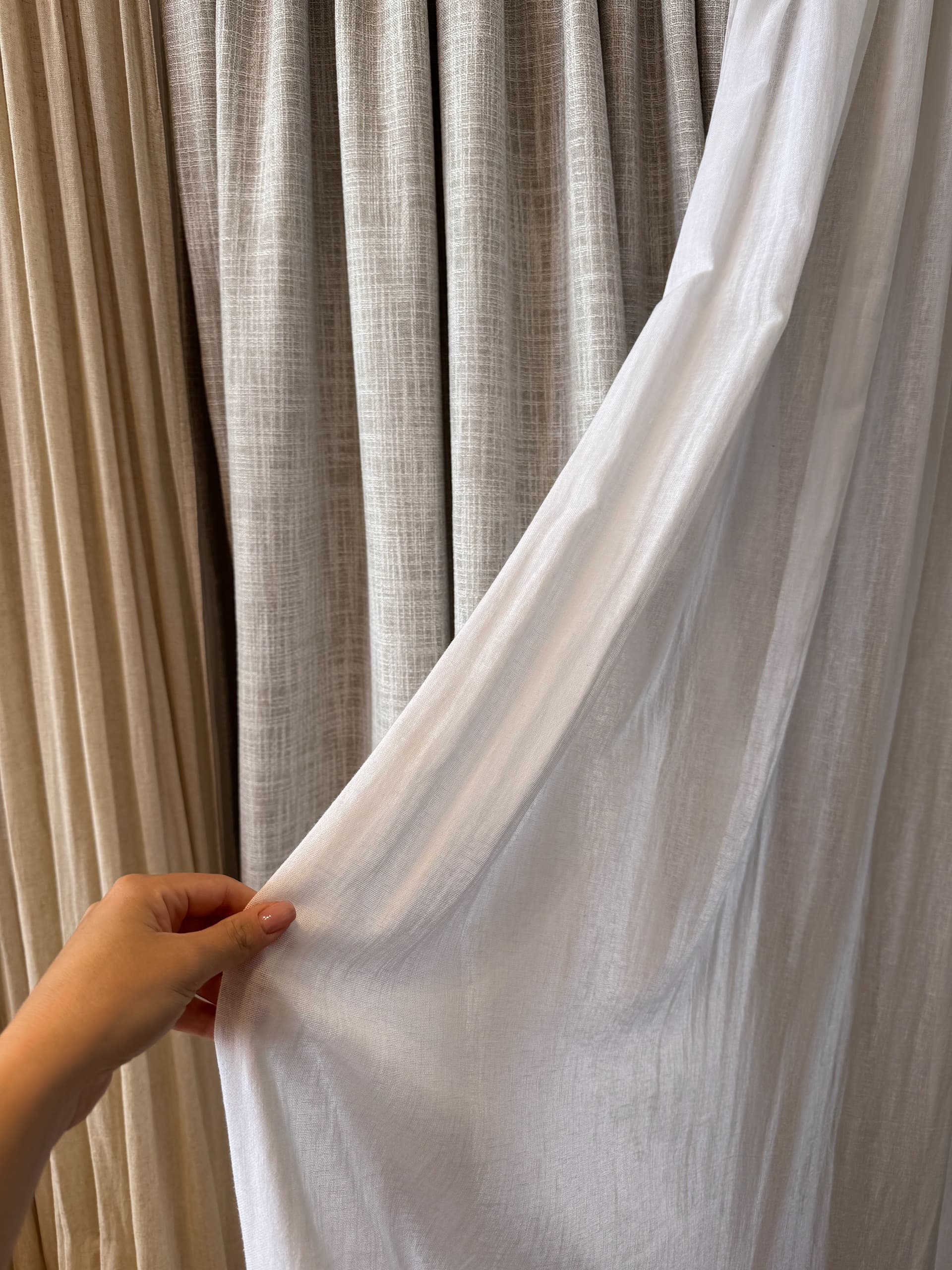 layered beige curtains window treatment